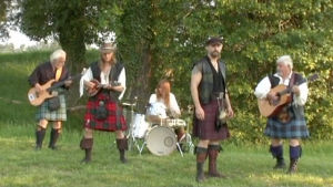 The Band "Coyote Run" playing on the grass