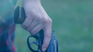 Woman's Hand on Pistol Closeup