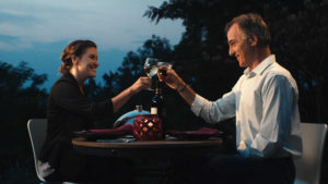 Couple toasting in outdoor restaurant