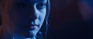 Closeup of girl in blue light