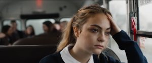 Closeup of teen girl on school bus